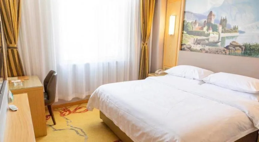 Bed in Vienna Hotel Shandong Linyi Mengyin