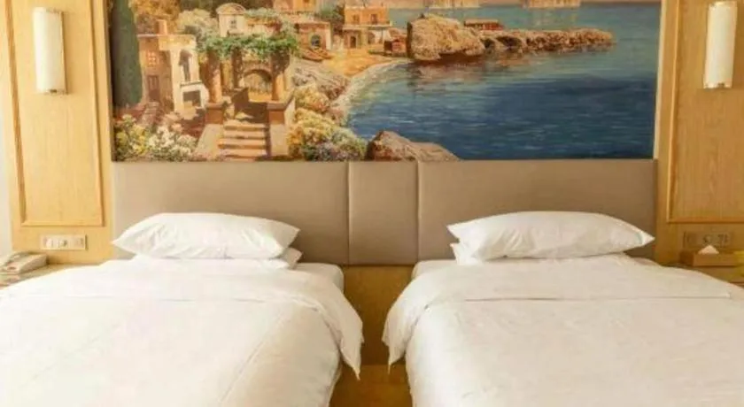 Bed in Vienna Hotel Shandong Linyi Mengyin