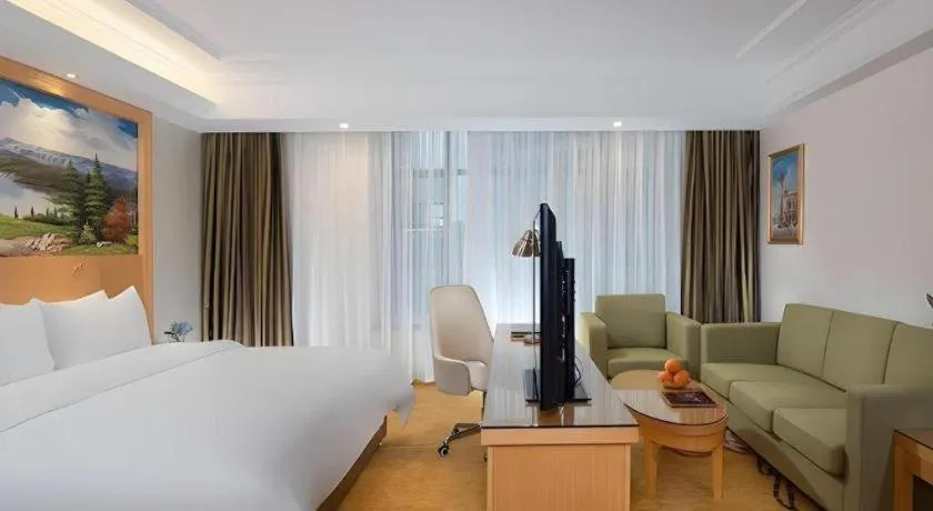 Bed in Vienna Hotel Guangdong Zhaoqing Sihui Tianguangxu