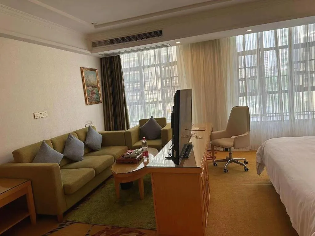 Bed in Vienna Hotel Guangdong Zhaoqing Sihui Tianguangxu