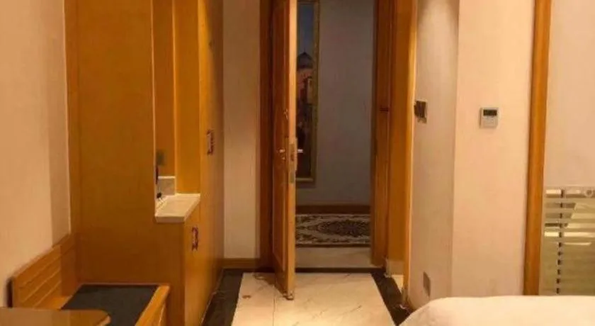 Bed in Vienna Hotel Guangdong Zhaoqing Sihui Tianguangxu