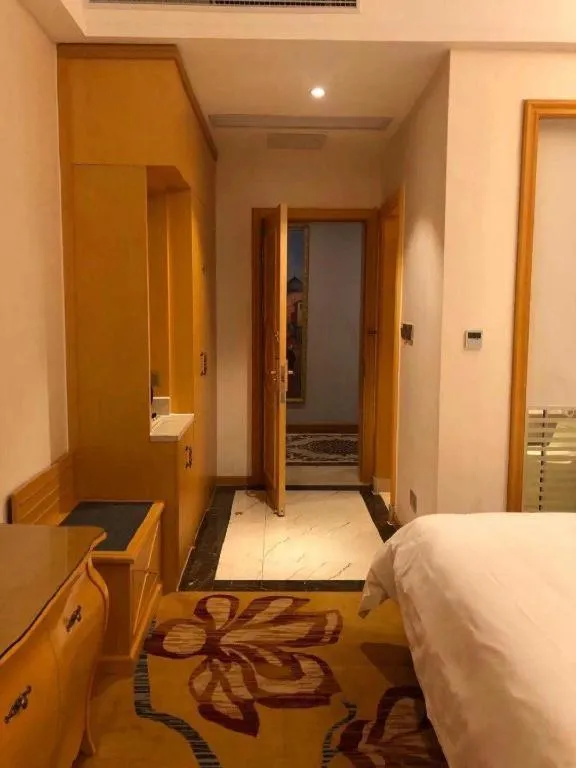 Bed in Vienna Hotel Guangdong Zhaoqing Sihui Tianguangxu
