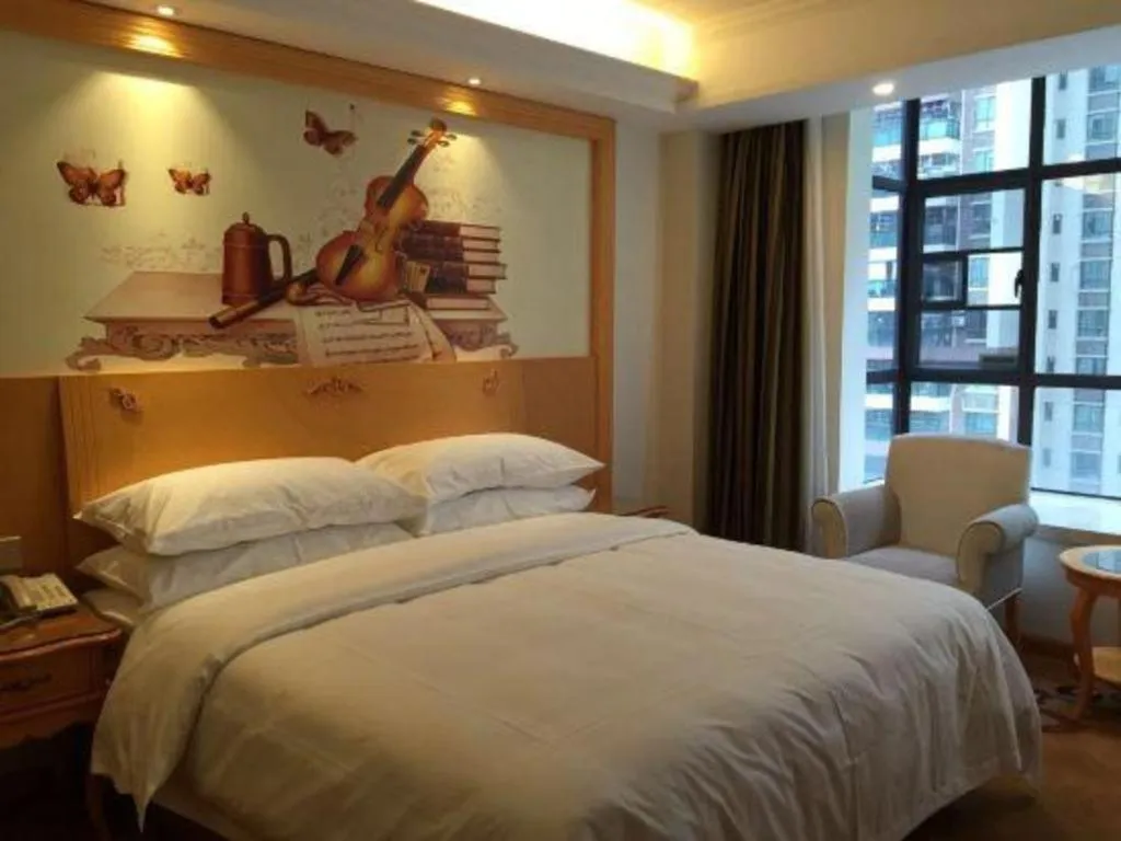 Bed in Vienna Hotel Guangdong Zhaoqing Sihui Tianguangxu