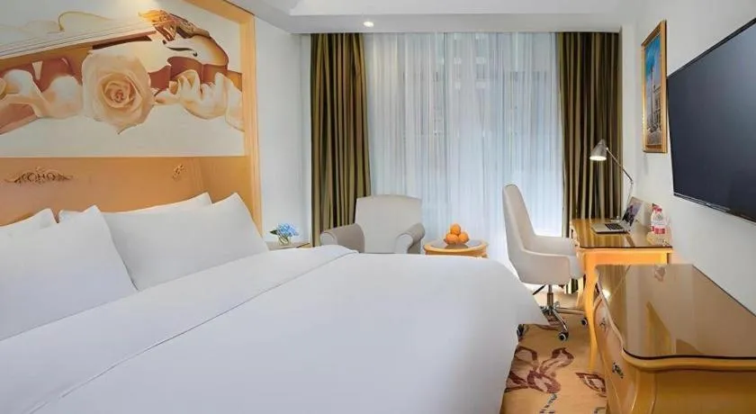 Bed in Vienna Hotel Guangdong Zhaoqing Sihui Tianguangxu