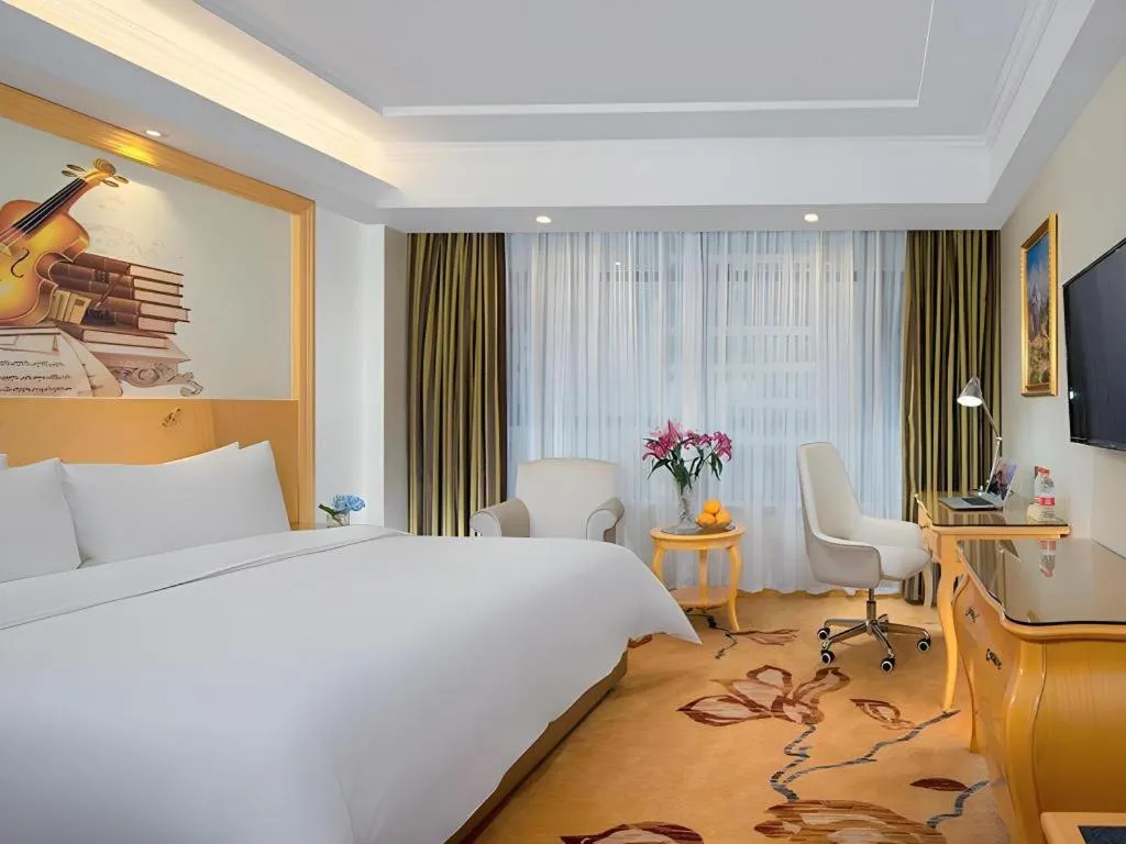 Bed in Vienna Hotel Guangdong Zhaoqing Sihui Tianguangxu