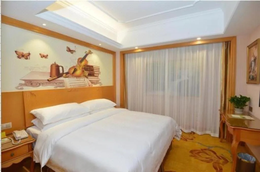 Bed in Vienna Hotel Shanghai Songjiang Market Miaoqian Street