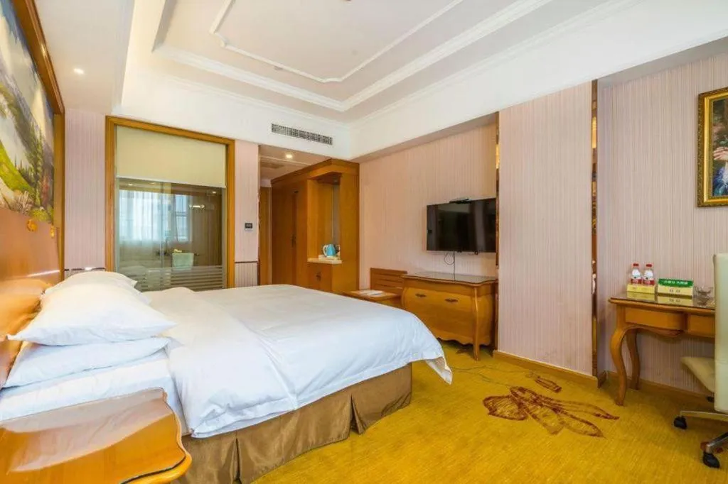 Bed in Vienna Hotel Shanghai Songjiang Market Miaoqian Street