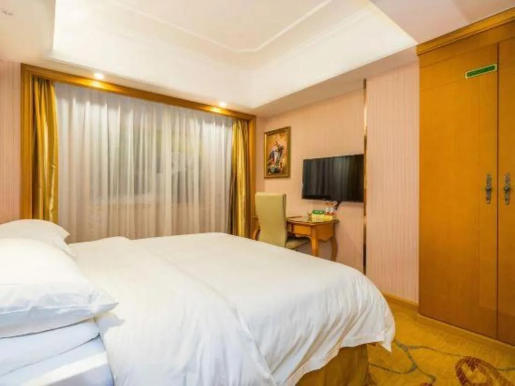 Bed in Vienna Hotel Shanghai Songjiang Market Miaoqian Street