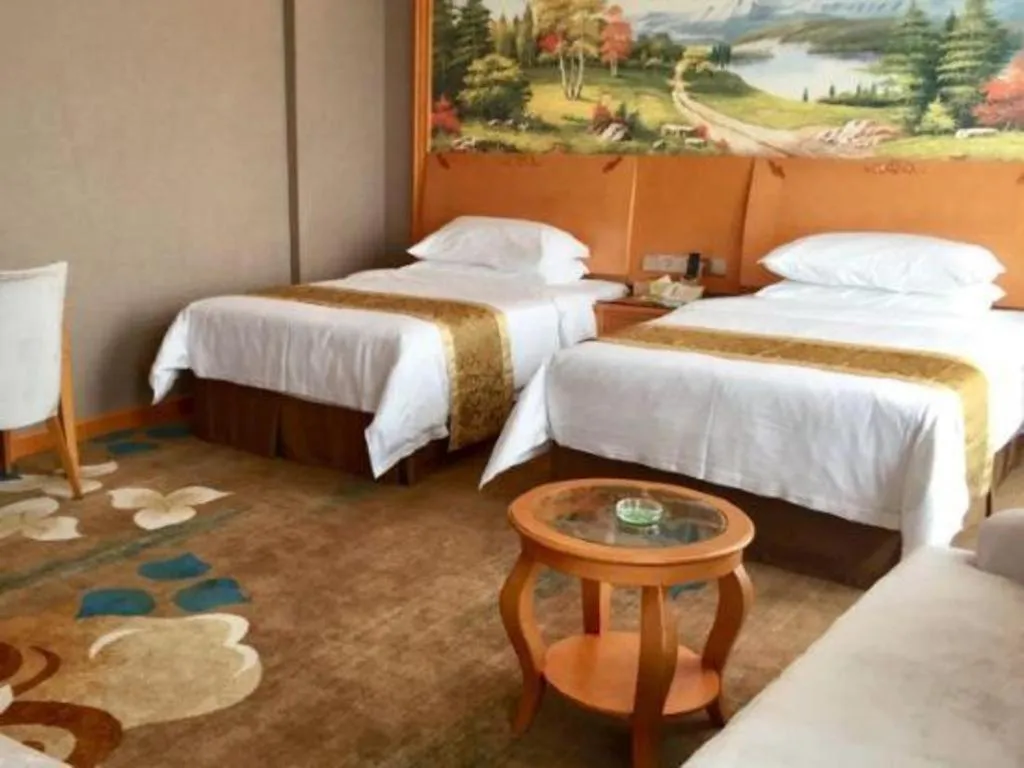 Bed in Vienna Hotel Guangdong Zhongshan Ancient Town Haizhou