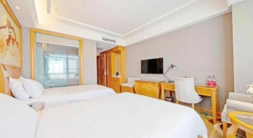 Bed in Vienna Hotel Guangdong Zhongshan Ancient Town Haizhou