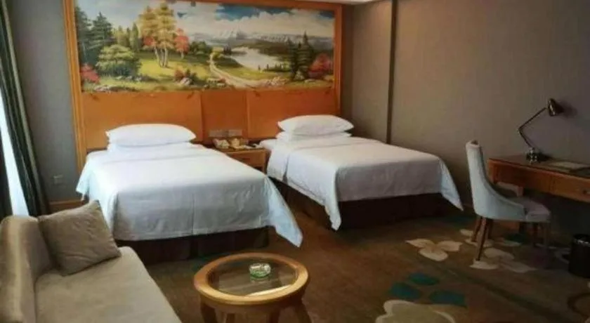 Bed in Vienna Hotel Guangdong Zhongshan Ancient Town Haizhou