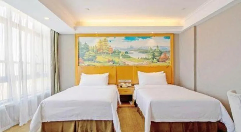 Bed in Vienna Hotel Guangdong Zhongshan Ancient Town Haizhou