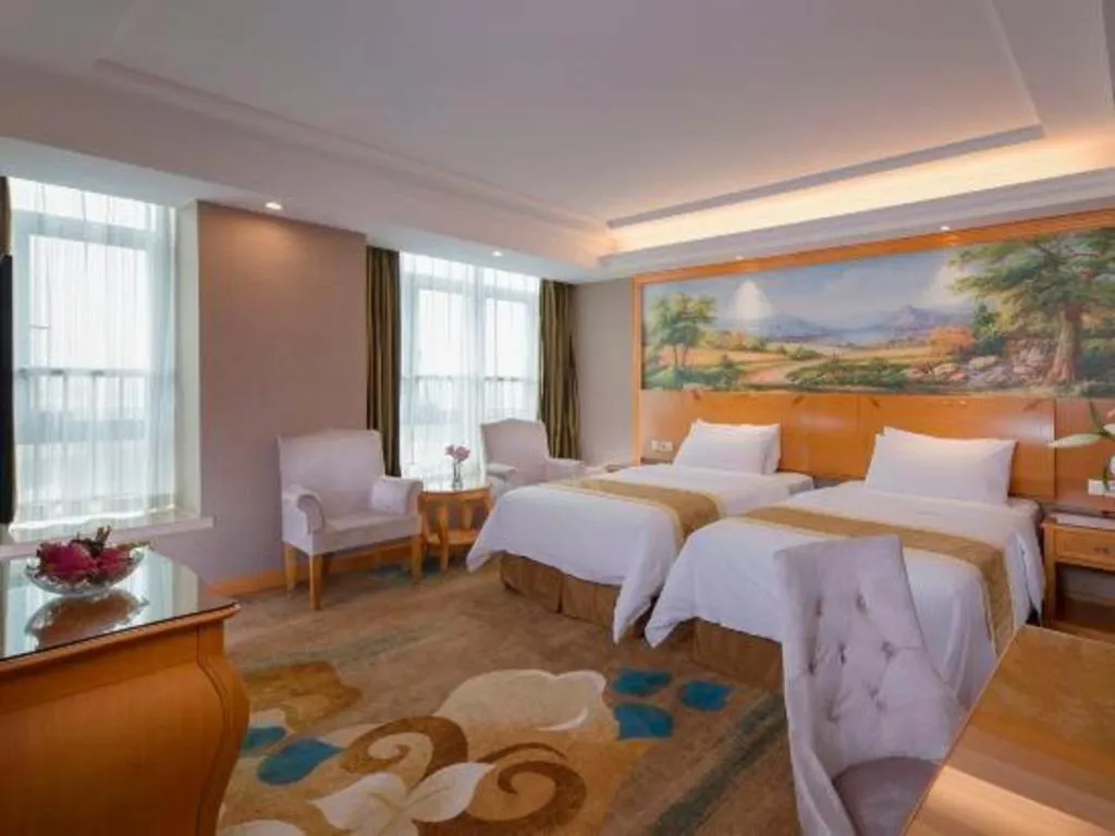 Bed in Vienna Hotel Guangdong Zhongshan Ancient Town Haizhou