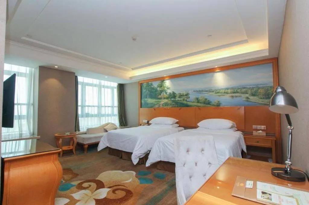 Bed in Vienna Hotel Guangdong Zhongshan Ancient Town Haizhou