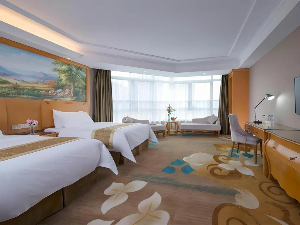 Bed in Vienna Hotel Guangdong Zhongshan Ancient Town Haizhou