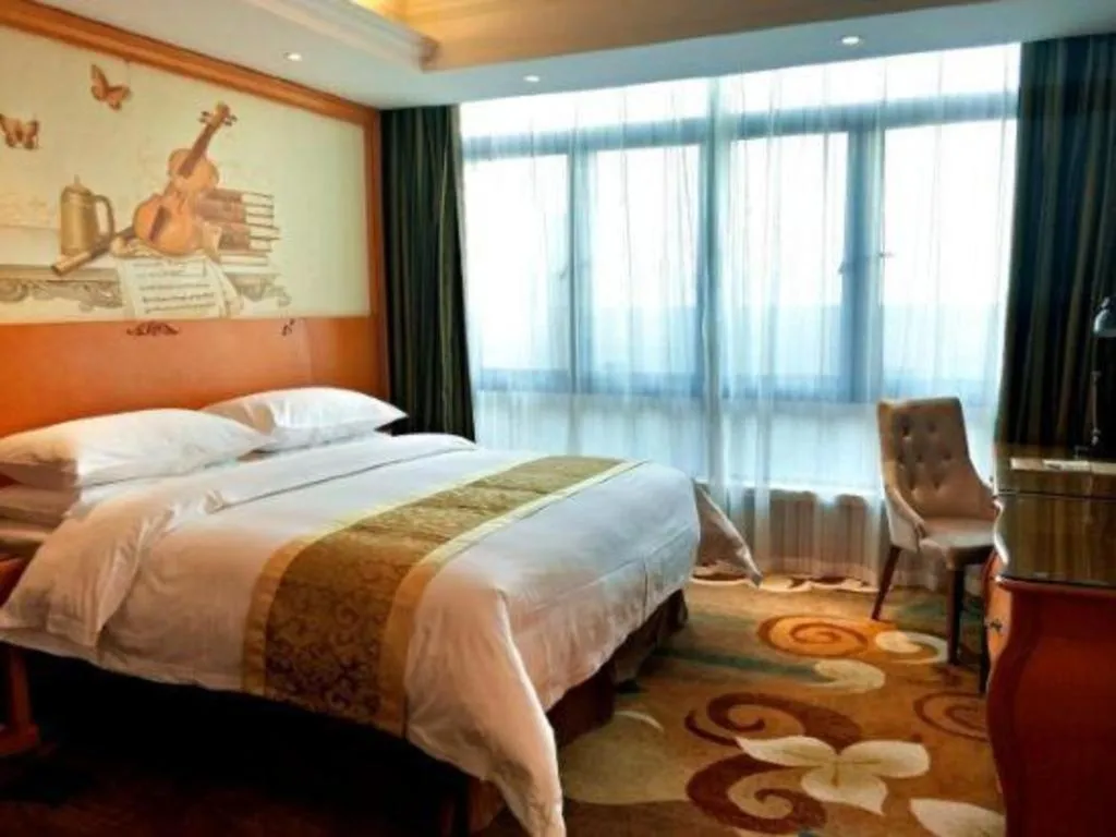 Bed in Vienna Hotel Guangdong Zhongshan Ancient Town Haizhou