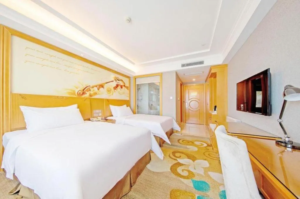 Bed in Vienna Hotel Guangdong Zhongshan Ancient Town Haizhou