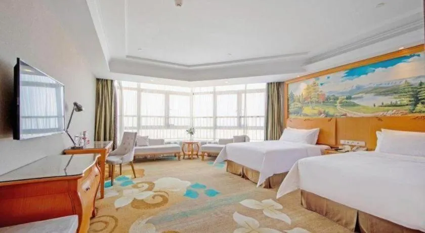 Bed in Vienna Hotel Guangdong Zhongshan Ancient Town Haizhou