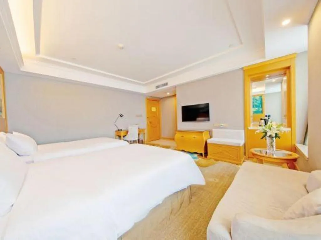 Bed in Vienna Hotel Guangdong Zhongshan Ancient Town Haizhou