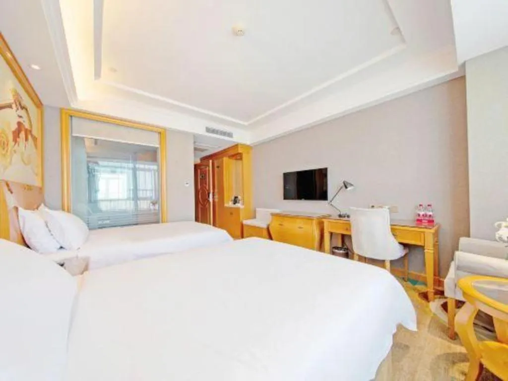 Bed in Vienna Hotel Guangdong Zhongshan Ancient Town Haizhou