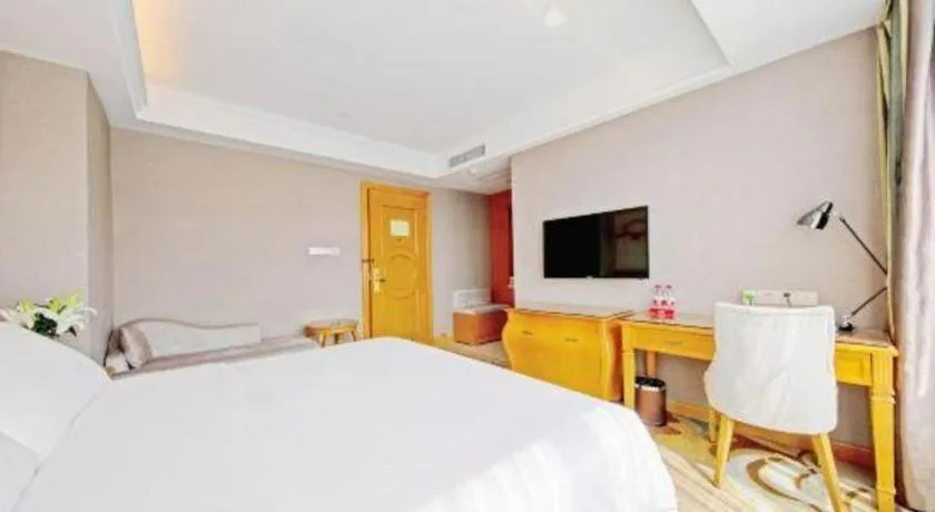 Bed in Vienna Hotel Guangdong Zhongshan Ancient Town Haizhou