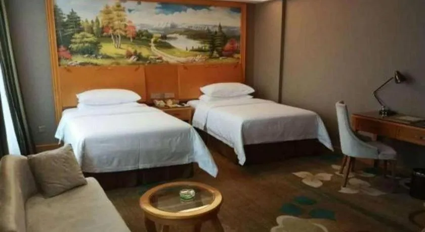 Bed in Vienna Hotel Guangdong Zhongshan Ancient Town Haizhou