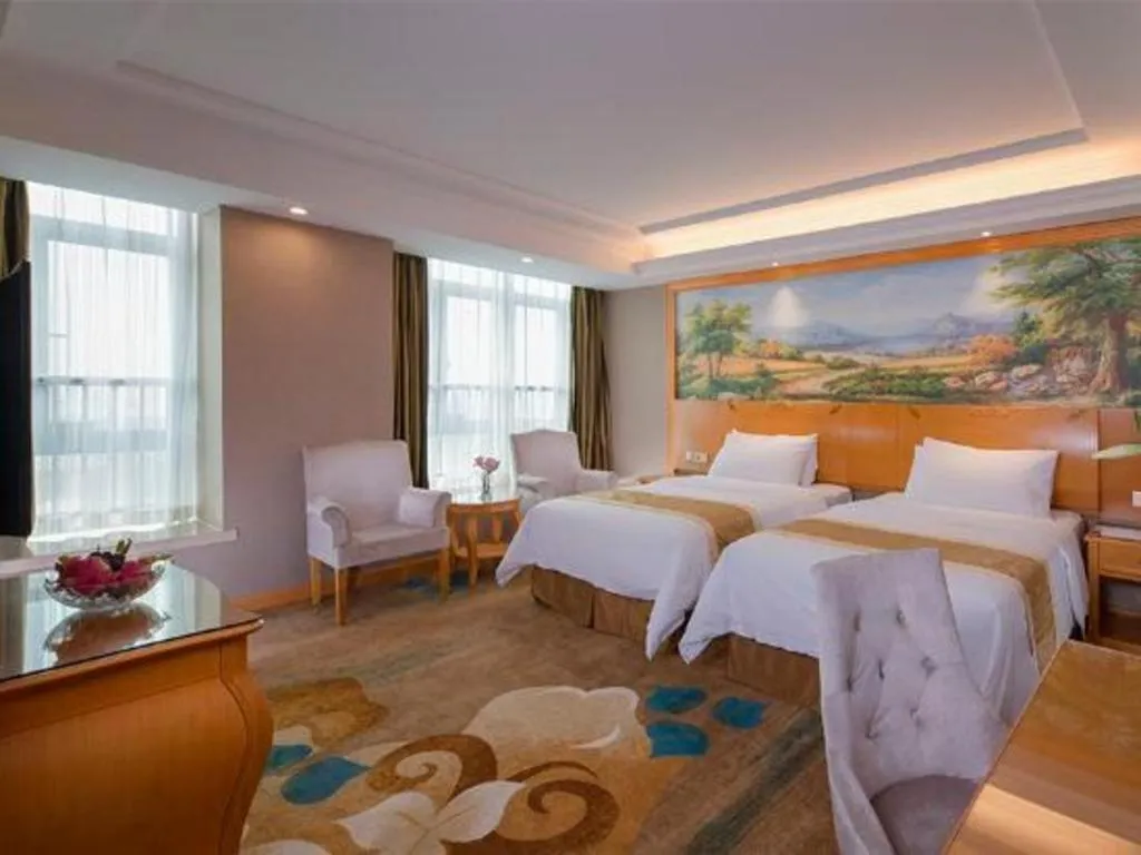 Bed in Vienna Hotel Guangdong Zhongshan Ancient Town Haizhou