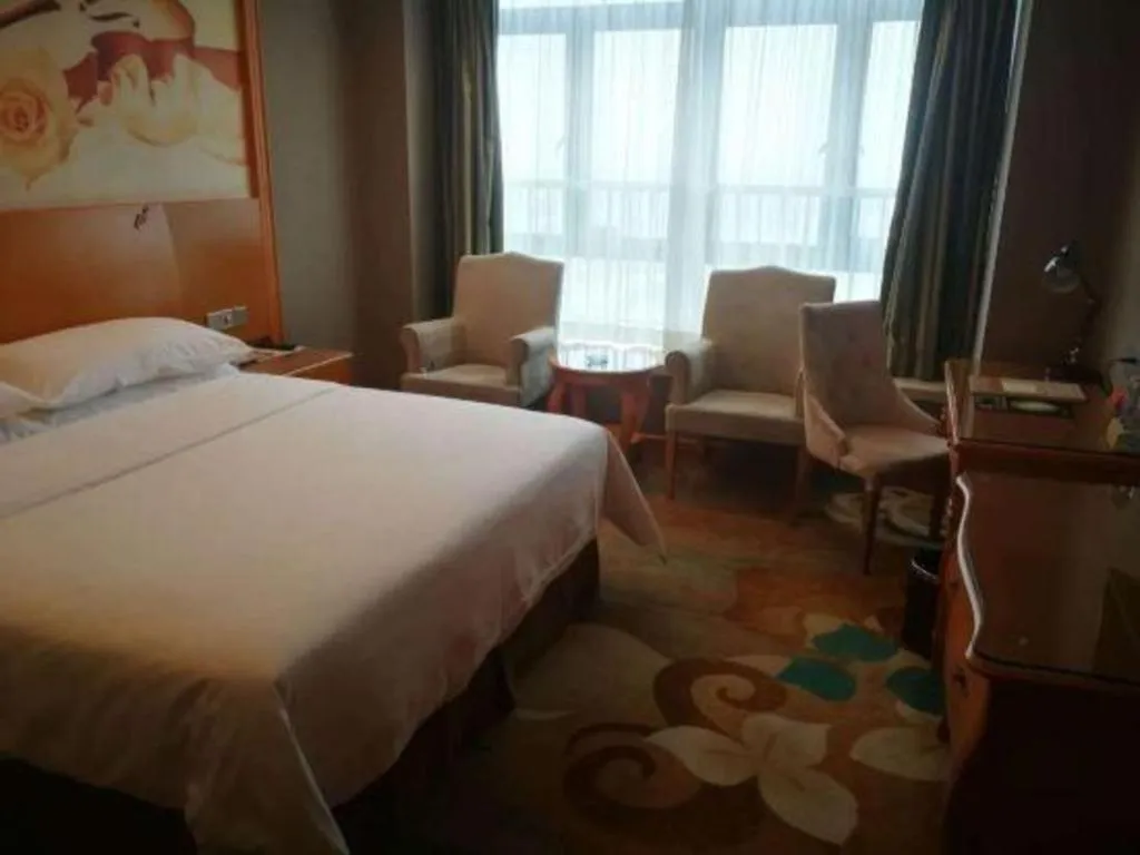 Bed in Vienna Hotel Guangdong Zhongshan Ancient Town Haizhou