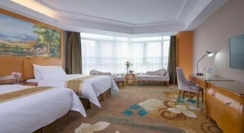 Bed in Vienna Hotel Guangdong Zhongshan Ancient Town Haizhou