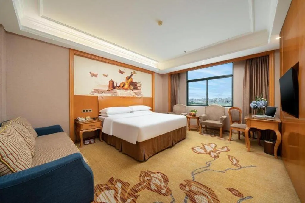 Bed in Vienna Hotel Nanning Anji Wanda 33rd Middle School Metro Station