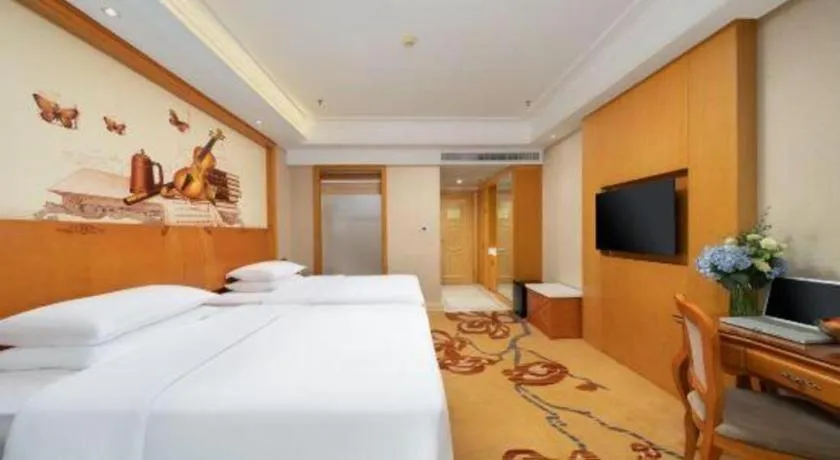 Bed in Vienna Hotel Nanning Anji Wanda 33rd Middle School Metro Station