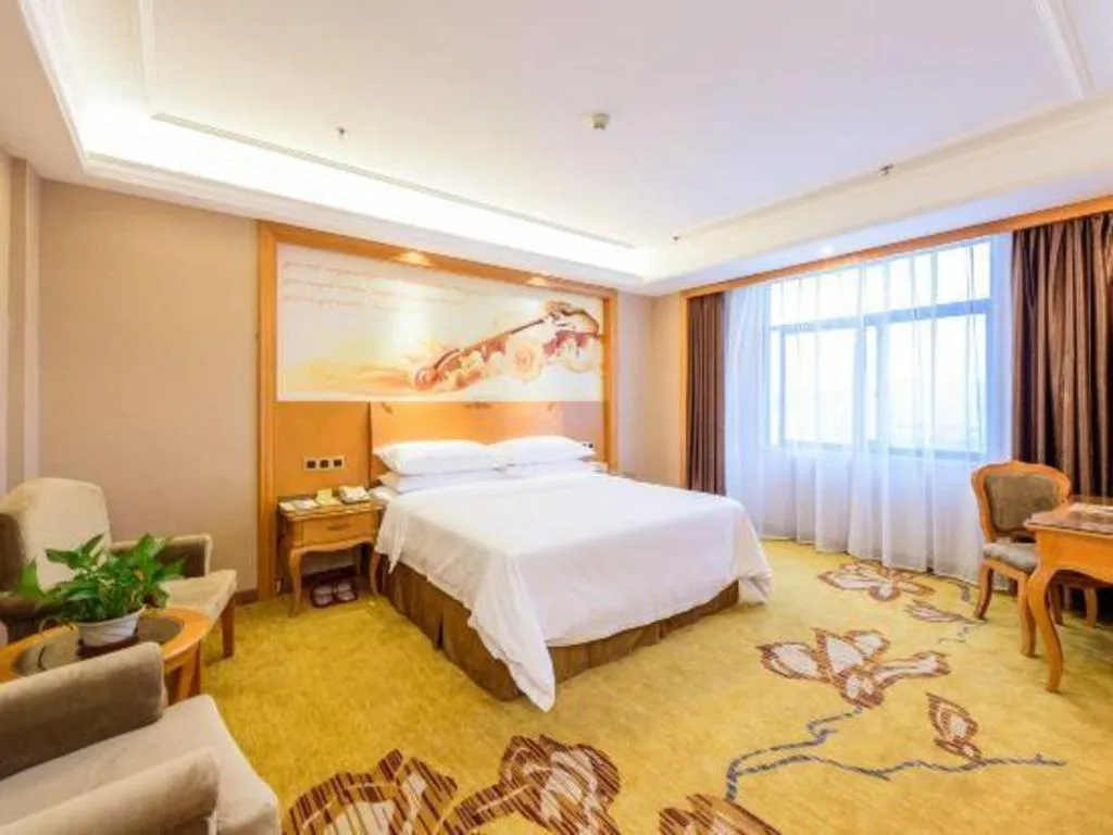 Bed in Vienna Hotel Nanning Anji Wanda 33rd Middle School Metro Station