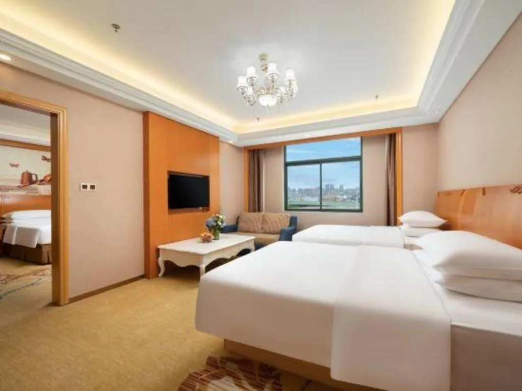 Bed in Vienna Hotel Nanning Anji Wanda 33rd Middle School Metro Station