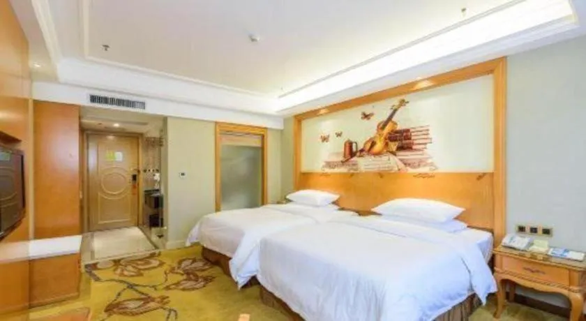 Bed in Vienna Hotel Nanning Anji Wanda 33rd Middle School Metro Station