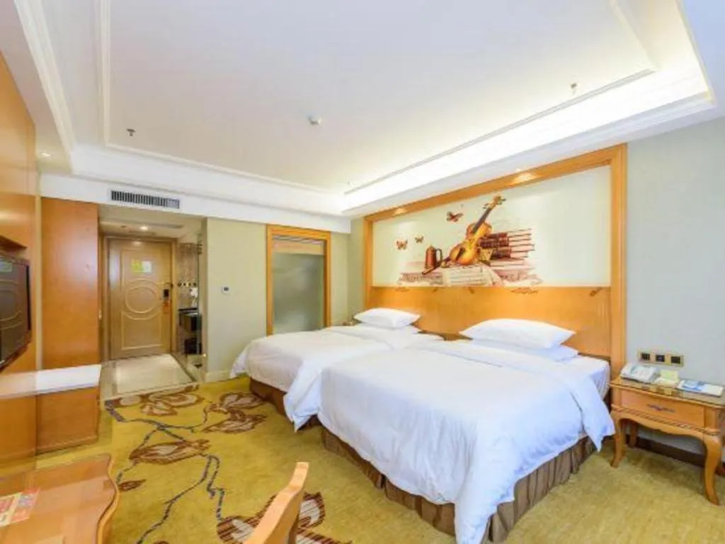 Bed in Vienna Hotel Nanning Anji Wanda 33rd Middle School Metro Station
