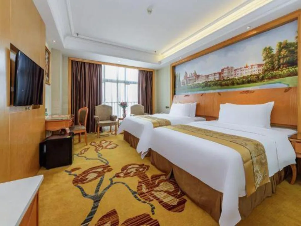 Bed in Vienna Hotel Nanning Anji Wanda 33rd Middle School Metro Station