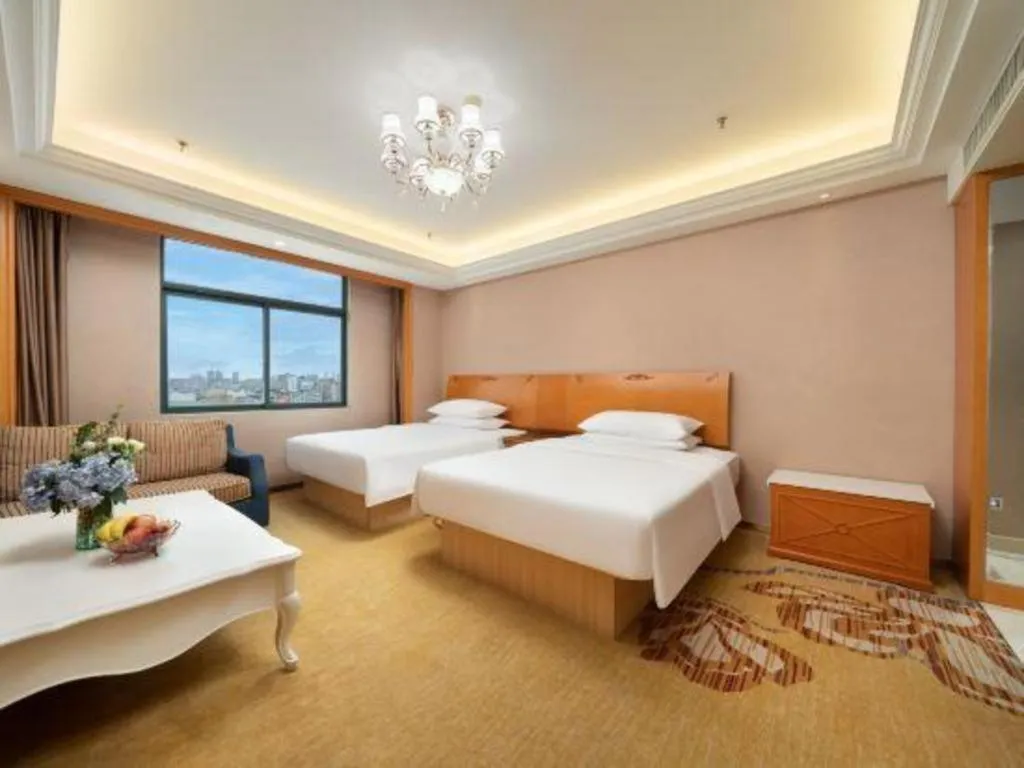 Bed in Vienna Hotel Nanning Anji Wanda 33rd Middle School Metro Station