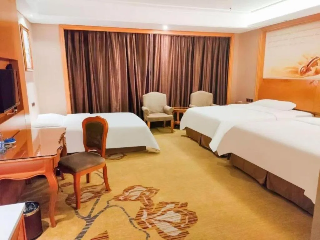 Bed in Vienna Hotel Nanning Anji Wanda 33rd Middle School Metro Station