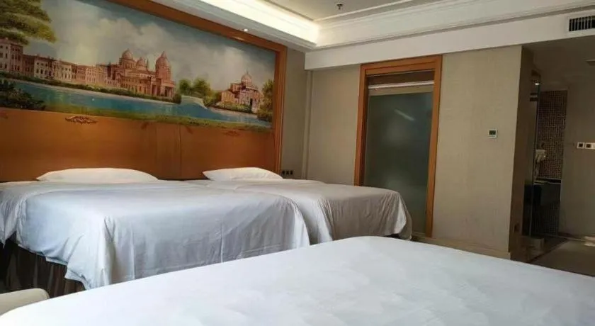 Bed in Vienna Hotel Nanning Anji Wanda 33rd Middle School Metro Station