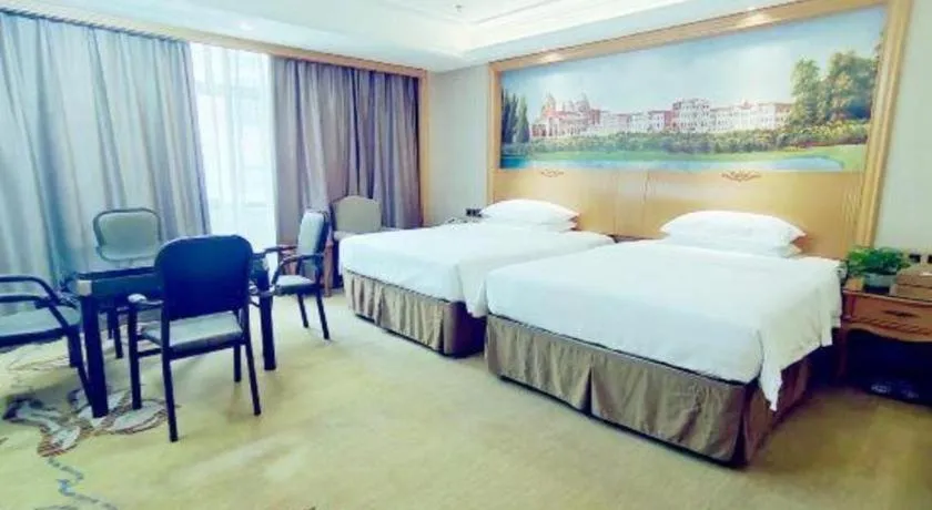 Bed in Vienna Hotel Nanning Anji Wanda 33rd Middle School Metro Station