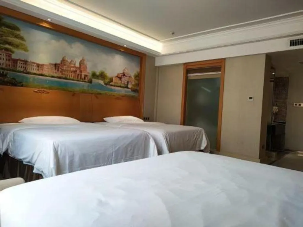 Bed in Vienna Hotel Nanning Anji Wanda 33rd Middle School Metro Station