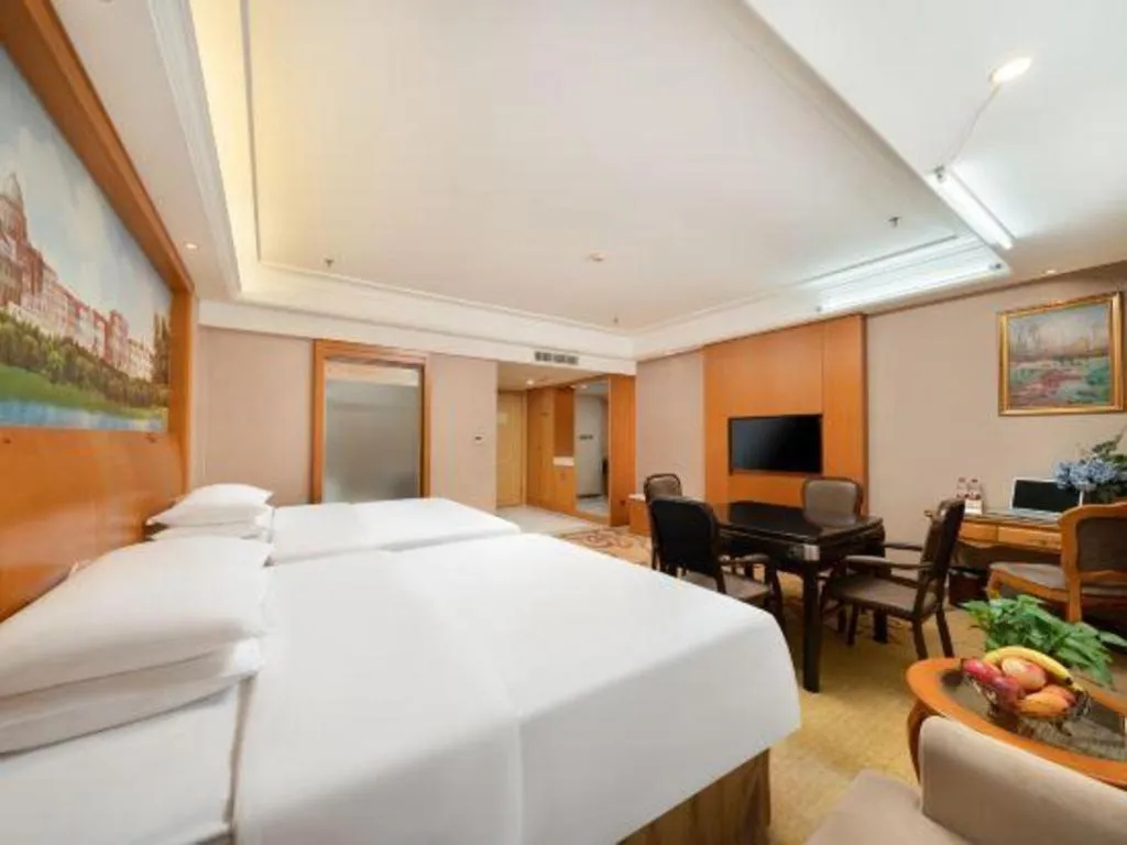 Bed in Vienna Hotel Nanning Anji Wanda 33rd Middle School Metro Station