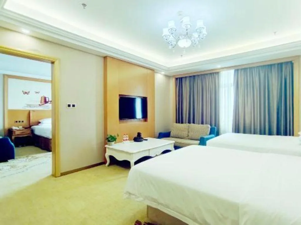 Bed in Vienna Hotel Nanning Anji Wanda 33rd Middle School Metro Station