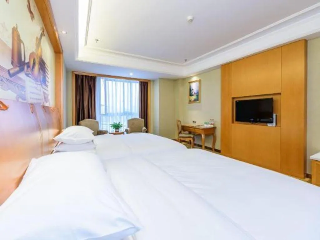 Bed in Vienna Hotel Nanning Anji Wanda 33rd Middle School Metro Station