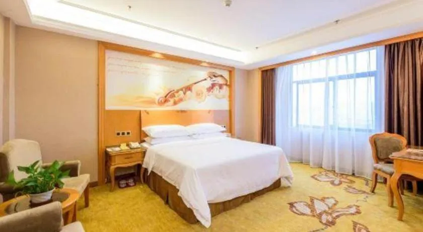 Bed in Vienna Hotel Nanning Anji Wanda 33rd Middle School Metro Station