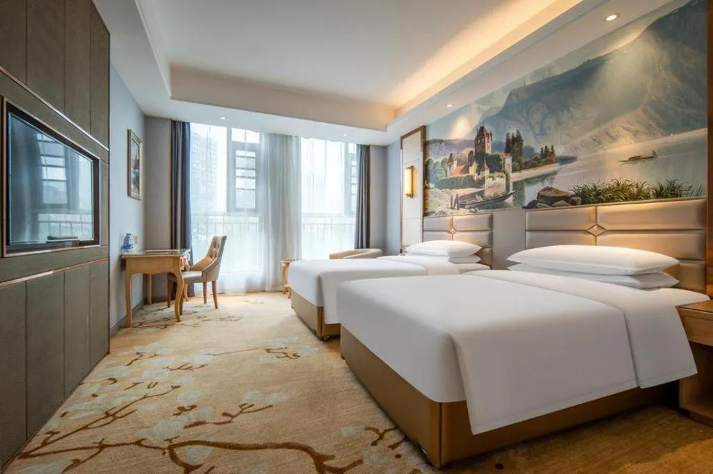 Bed in Vienna Hotel Wuhan Guobo Jiangang Metro Station