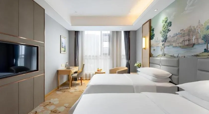 Bed in Vienna Hotel Wuhan Guobo Jiangang Metro Station