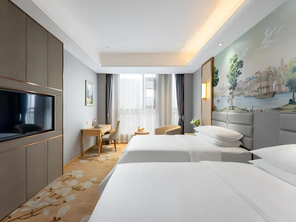 Bed in Vienna Hotel Wuhan Guobo Jiangang Metro Station