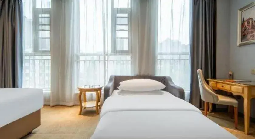 Bed in Vienna Hotel Wuhan Guobo Jiangang Metro Station Bed in Vienna Hotel Wuhan Guobo Jiangang Metro Station