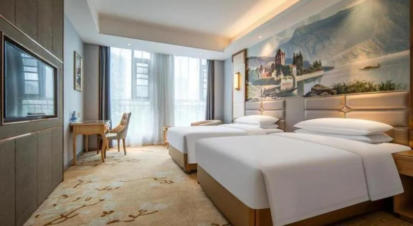 Bed in Vienna Hotel Wuhan Guobo Jiangang Metro Station